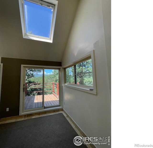 383 Evergreen Rd, Black Hawk, CO 80422 - spare room with baseboards and high vaulted ceiling