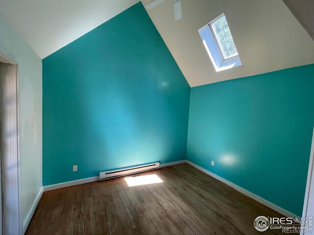 383 Evergreen Rd, Black Hawk, CO 80422 - additional living space with baseboard heating, lofted ceiling, a skylight, and hardwood / wood-style floors