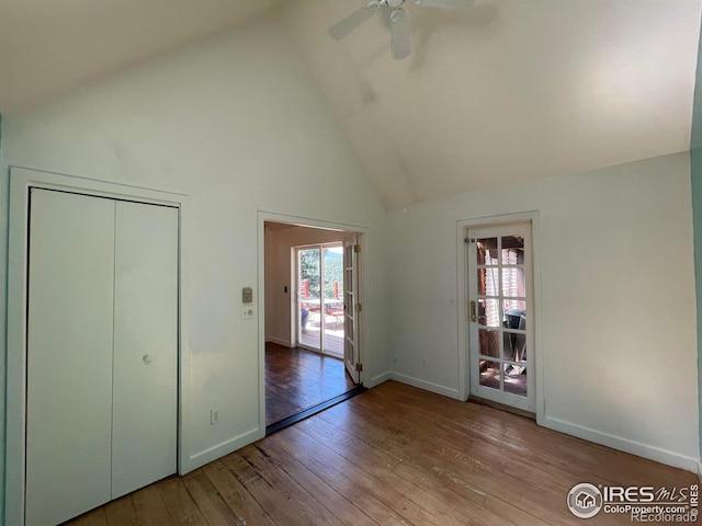 383 Evergreen Rd, Black Hawk, CO 80422 - unfurnished bedroom featuring high vaulted ceiling, hardwood / wood-style floors, a ceiling fan, and a closet