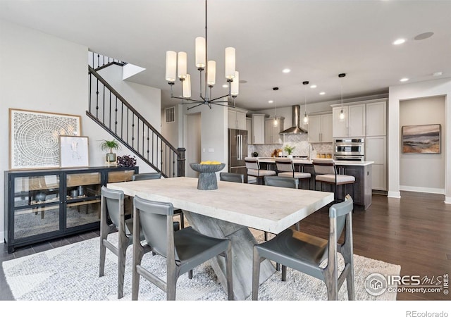 3315 Heron Lakes Pkwy, Berthoud, CO 80513 - dining room with stairway, dark wood-style floors, recessed lighting, and a chandelier