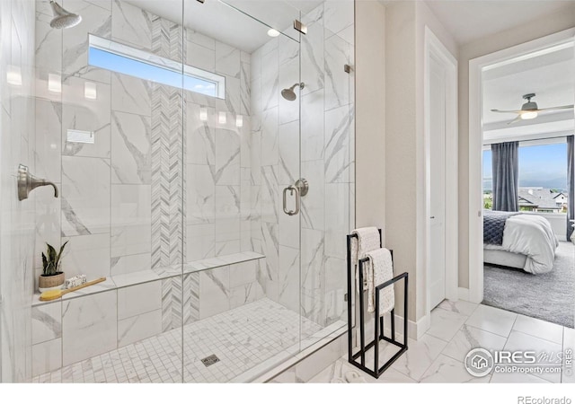 3315 Heron Lakes Pkwy, Berthoud, CO 80513 - ensuite bathroom featuring marble look tile flooring, a marble finish shower, and ceiling fan