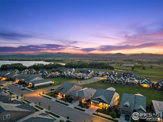 3315 Heron Lakes Pkwy, Berthoud, CO 80513 - aerial perspective of suburban area featuring a mountainous background