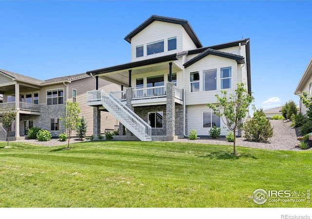 3315 Heron Lakes Pkwy, Berthoud, CO 80513 - back of property featuring a lawn and stairs