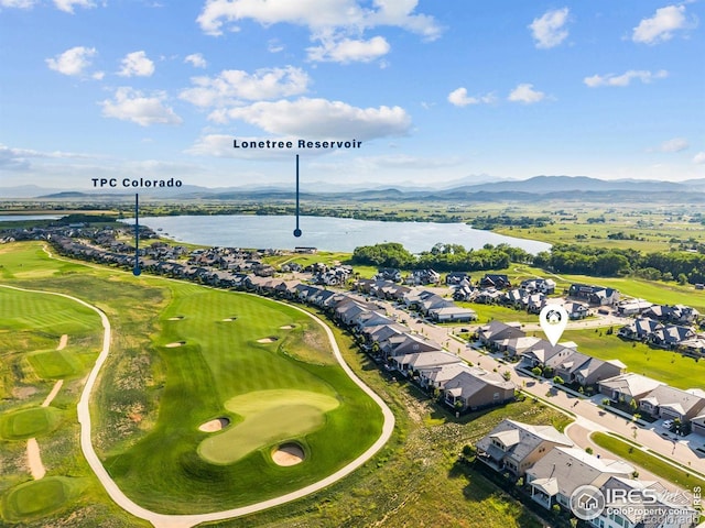 3315 Heron Lakes Pkwy, Berthoud, CO 80513 - aerial perspective of suburban area with a water and mountain view and a local golf course