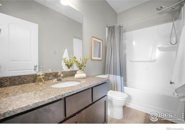 1384 S Growers Dr, Milliken, CO 80543 - bathroom with vanity, shower / tub combo with curtain, wood finished floors, and vaulted ceiling