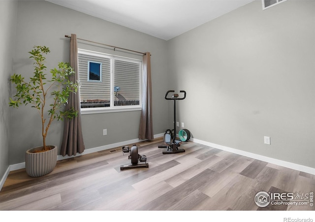 1384 S Growers Dr, Milliken, CO 80543 - exercise area with wood finished floors and baseboards