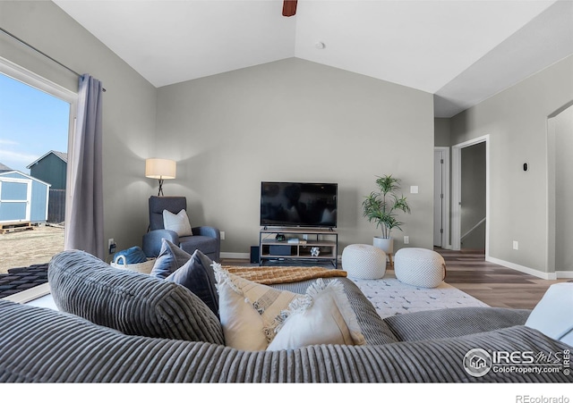 1384 S Growers Dr, Milliken, CO 80543 - living area featuring wood finished floors, vaulted ceiling, and a ceiling fan