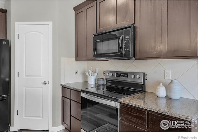 1384 S Growers Dr, Milliken, CO 80543 - kitchen featuring black appliances, tasteful backsplash, dark brown cabinetry, and stone counters