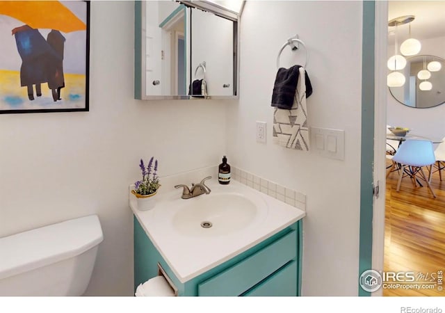 3240 Iris Ave Unit 201, Boulder, CO 80301 - bathroom with vanity and wood finished floors