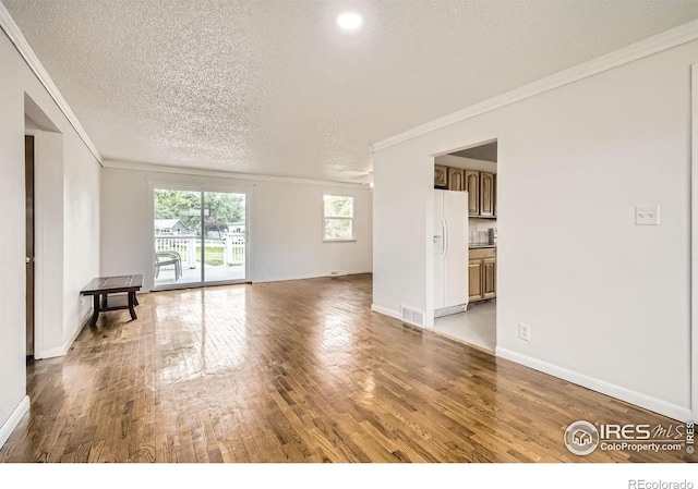 4331 Page Pl, Loveland, CO 80537 - unfurnished room with ornamental molding, a textured ceiling, and light wood-style floors