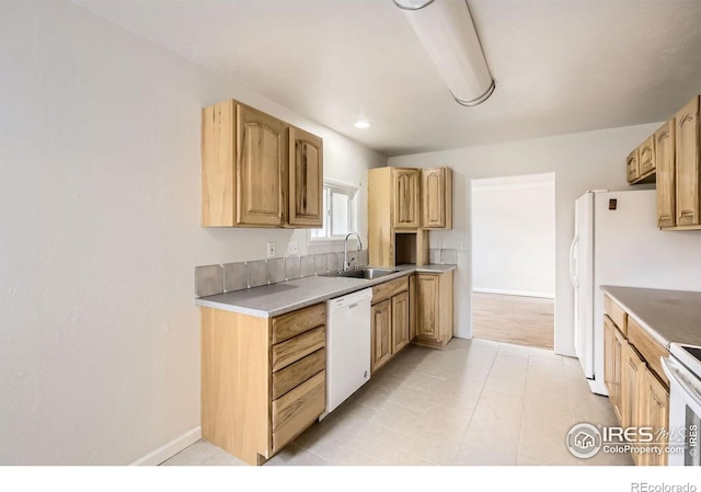 4331 Page Pl, Loveland, CO 80537 - kitchen with white dishwasher, range, light countertops, and light tile patterned flooring