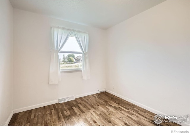4331 Page Pl, Loveland, CO 80537 - unfurnished room featuring wood finished floors and baseboards