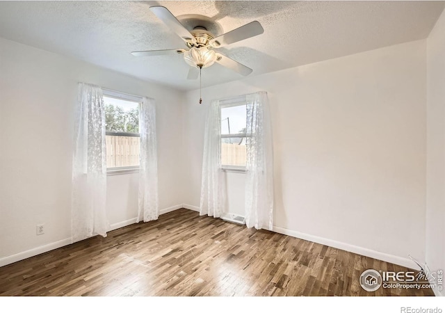 4331 Page Pl, Loveland, CO 80537 - unfurnished room with wood finished floors, ceiling fan, and a textured ceiling