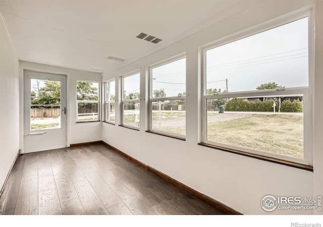 4331 Page Pl, Loveland, CO 80537 - unfurnished sunroom featuring wood finished floors and baseboards