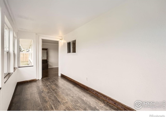 4331 Page Pl, Loveland, CO 80537 - empty room featuring dark wood finished floors and baseboards