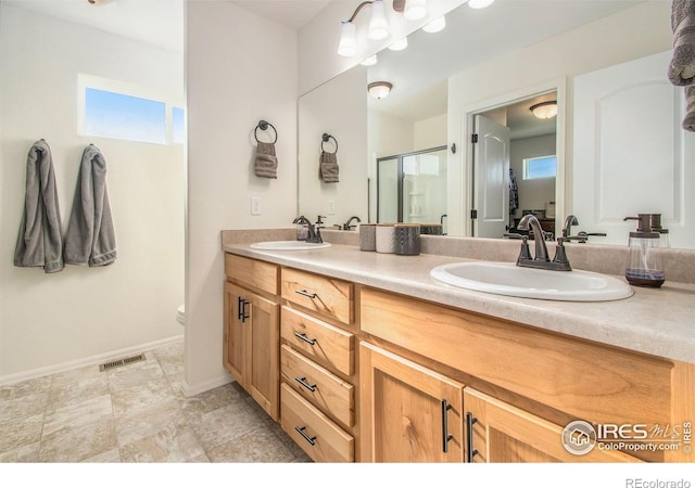 1103 Ibex Dr, Severance, CO 80550 - bathroom with double vanity and a stall shower