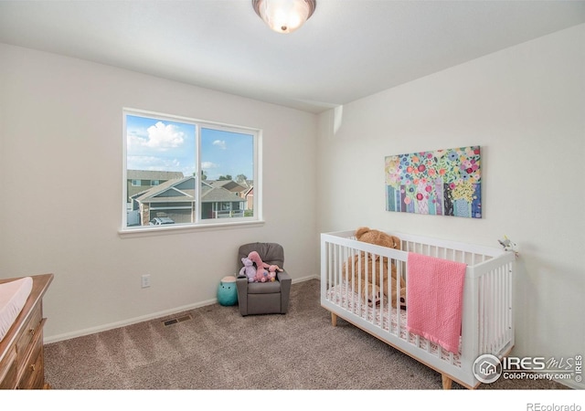 1103 Ibex Dr, Severance, CO 80550 - carpeted bedroom with a crib and baseboards