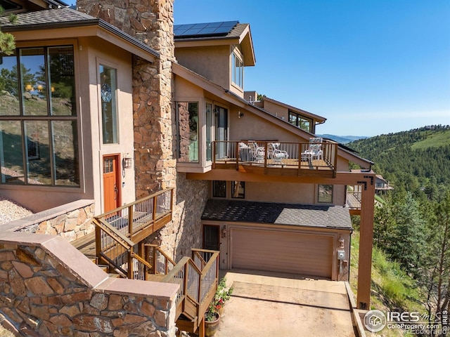 6183 Red Hill Rd, Boulder, CO 80302 - exterior space featuring a garage, concrete driveway, and a mountain view