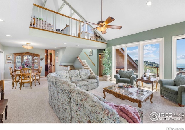 6183 Red Hill Rd, Boulder, CO 80302 - living room with light colored carpet, stairway, a ceiling fan, high vaulted ceiling, and recessed lighting