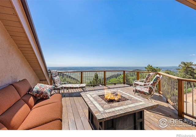 6183 Red Hill Rd, Boulder, CO 80302 - wooden deck featuring an outdoor fire pit and a water view