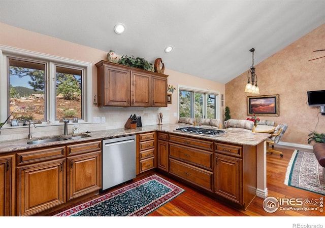 6183 Red Hill Rd, Boulder, CO 80302 - kitchen with stainless steel appliances, lofted ceiling, brown cabinetry, a peninsula, and dark wood-style floors