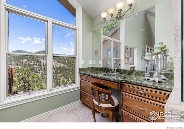 6183 Red Hill Rd, Boulder, CO 80302 - bathroom with vanity, plenty of natural light, and a chandelier