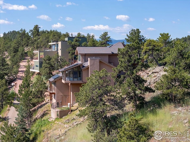 6183 Red Hill Rd, Boulder, CO 80302 - view of side of property featuring stucco siding and a balcony