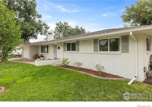 2306 Ptelea Ct, Loveland, CO 80538 - ranch-style home with a chimney, brick siding, an attached garage, a front yard, and roof with shingles