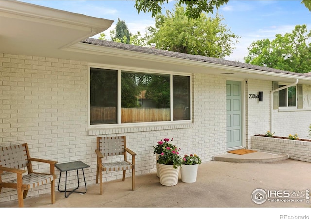 2306 Ptelea Ct, Loveland, CO 80538 - view of exterior entry featuring brick siding