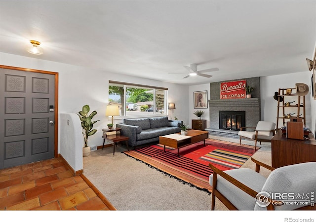 2306 Ptelea Ct, Loveland, CO 80538 - living area featuring a fireplace and a ceiling fan