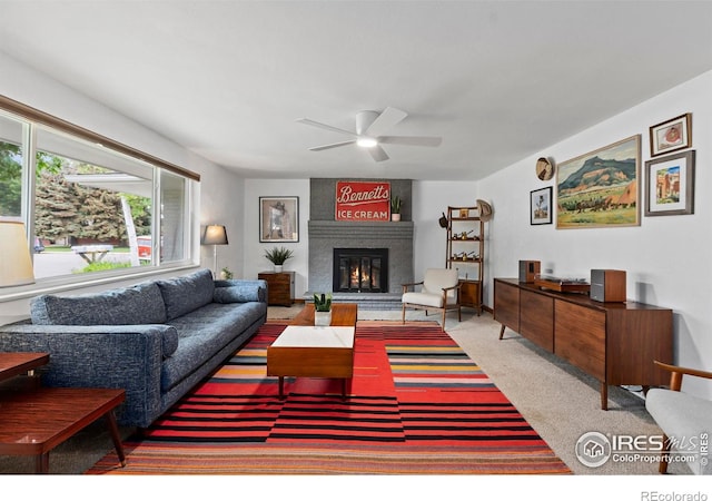 2306 Ptelea Ct, Loveland, CO 80538 - carpeted living area with a ceiling fan and a brick fireplace