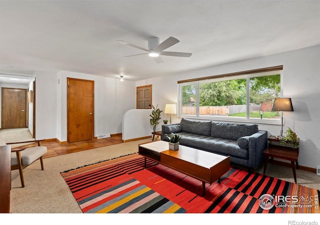 2306 Ptelea Ct, Loveland, CO 80538 - carpeted living room featuring a ceiling fan and baseboards