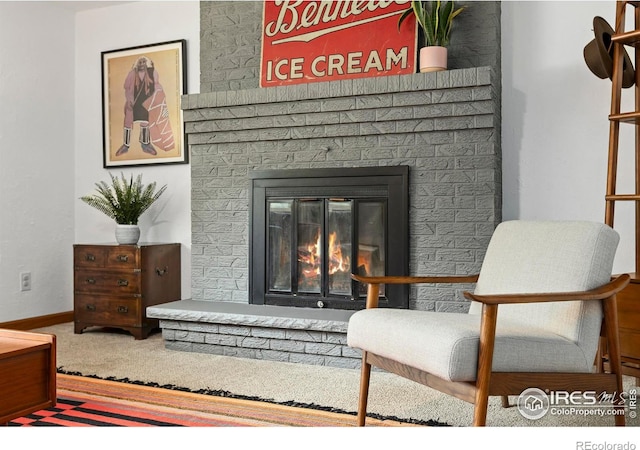 2306 Ptelea Ct, Loveland, CO 80538 - sitting room featuring carpet and a brick fireplace