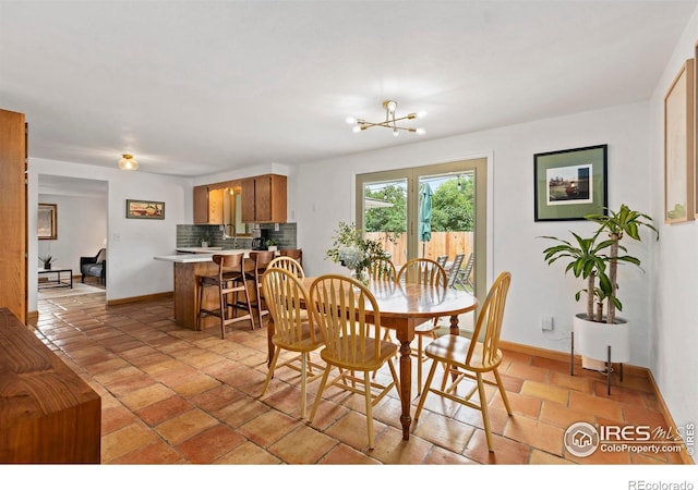 2306 Ptelea Ct, Loveland, CO 80538 - dining room with baseboards and a chandelier