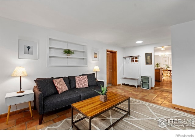 2306 Ptelea Ct, Loveland, CO 80538 - living room featuring built in features, recessed lighting, and light tile patterned floors