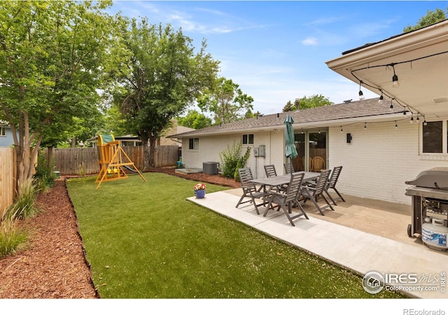 2306 Ptelea Ct, Loveland, CO 80538 - fenced backyard with a playground and a patio area