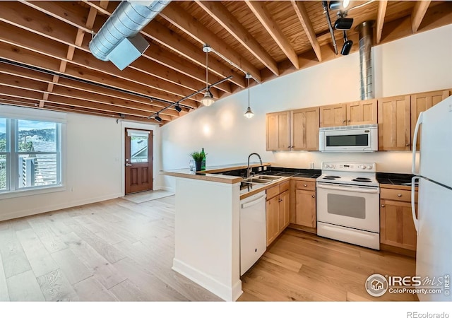 1941 Pearl St Unit 303, Boulder, CO 80302 - kitchen with white appliances, a peninsula, light brown cabinets, light wood finished floors, and beam ceiling