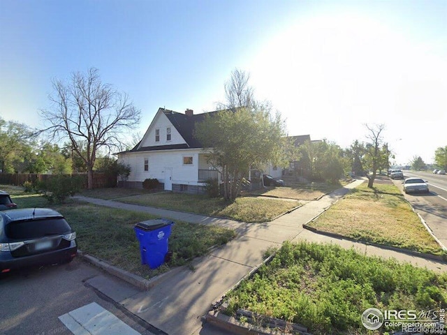 929 5th St, Greeley, CO 80631 - view of side of home with a lawn