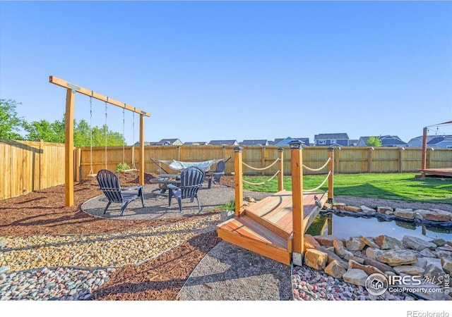 437 Buckskin Rd, Berthoud, CO 80513 - fenced backyard featuring a fire pit