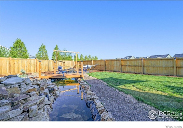 437 Buckskin Rd, Berthoud, CO 80513 - fenced backyard featuring a wooden deck