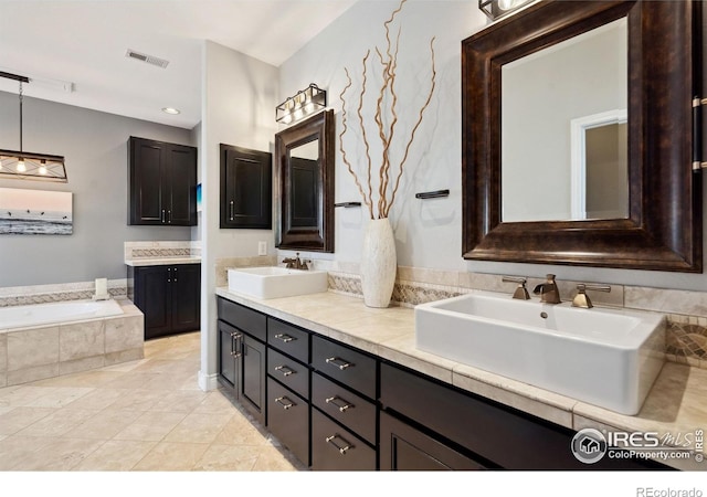 4926 Saint Andrews Ct, Loveland, CO 80537 - full bathroom featuring double vanity, a garden tub, and tile patterned flooring