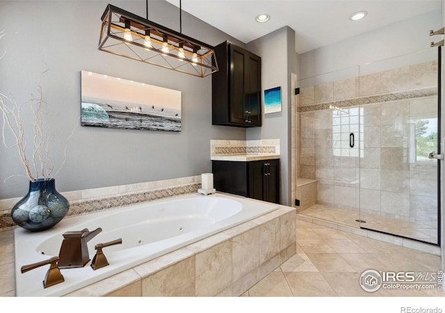 4926 Saint Andrews Ct, Loveland, CO 80537 - full bathroom featuring a jetted tub, a stall shower, recessed lighting, vanity, and tile patterned floors