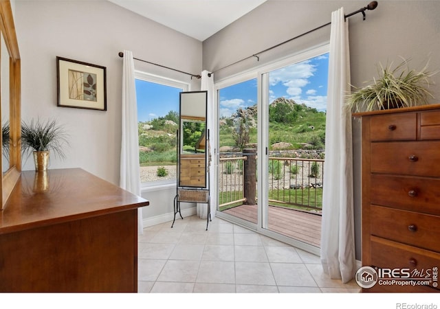 4926 Saint Andrews Ct, Loveland, CO 80537 - living area with plenty of natural light and light tile patterned floors
