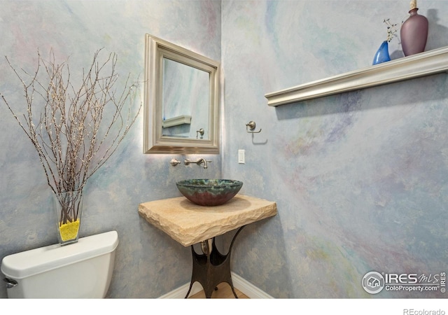 4926 Saint Andrews Ct, Loveland, CO 80537 - half bathroom with a sink and toilet
