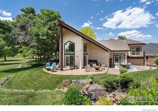 4926 Saint Andrews Ct, Loveland, CO 80537 - back of house with stucco siding, a patio area, and a yard
