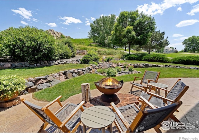 4926 Saint Andrews Ct, Loveland, CO 80537 - view of patio / terrace with an outdoor fire pit