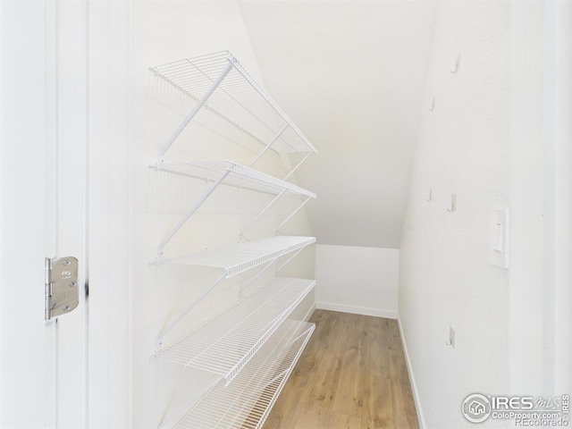 3840 Katmai Ave, Evans, CO 80620 - walk in closet featuring wood finished floors and lofted ceiling