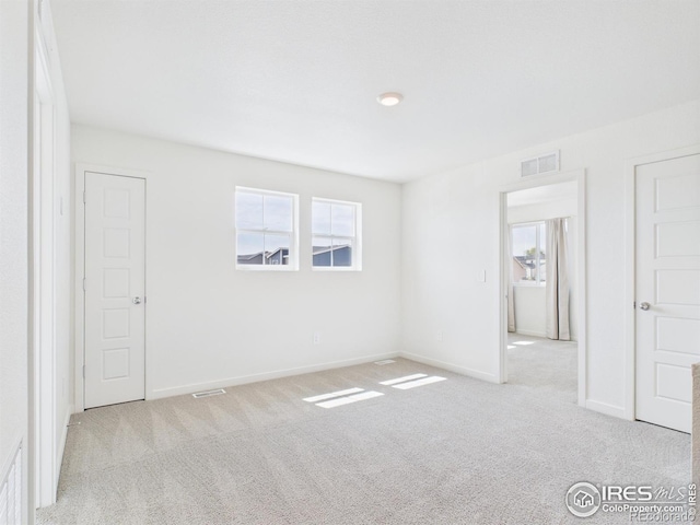3840 Katmai Ave, Evans, CO 80620 - unfurnished bedroom featuring carpet flooring and multiple windows