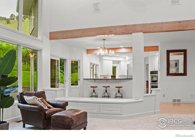 3421 4th St, Boulder, CO 80304 - living room with beamed ceiling and a chandelier
