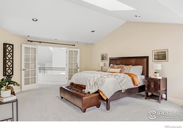 3421 4th St, Boulder, CO 80304 - bedroom featuring light colored carpet, a skylight, french doors, vaulted ceiling, and recessed lighting